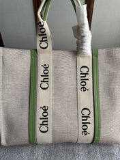 LAGRE WOODY TOTE BAG 45 IN BEIGE LINEN CANVAS BLACK WEBBING LOGO EMBROIDER GREEN CALFSKIN