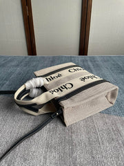SMALL STRAP WOODY TOTE BAG 26.5 IN BEIGE LINEN CANVAS BLACK WEBBING LOGO EMBROIDER BLACK CALFSKIN