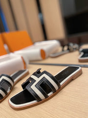 0RAN SANDALS IN BLACK CALFSKIN AND WHITE CANVAS