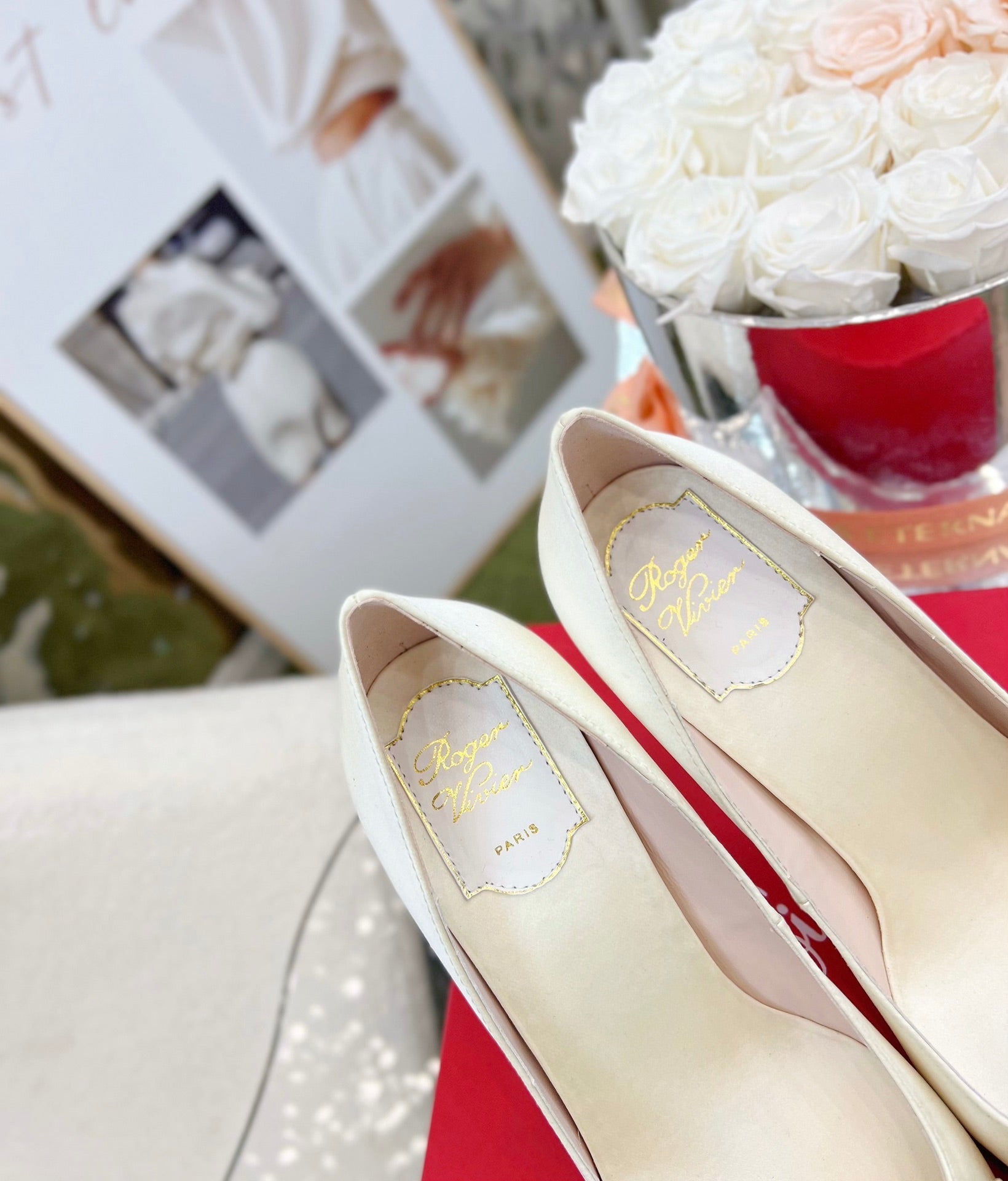 EFFLORESCENCE POINTED-TOE PUMPS IN WHITE SATIN WITH CRYSTAL BUCKLE