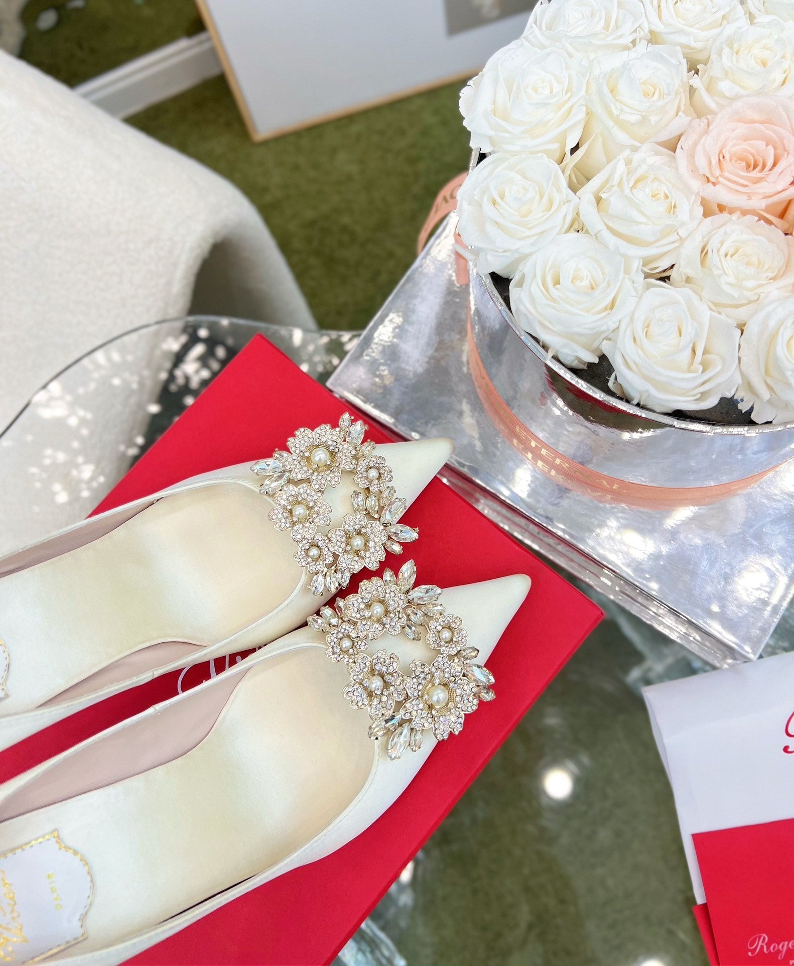 EFFLORESCENCE POINTED-TOE PUMPS IN WHITE SATIN WITH CRYSTAL BUCKLE