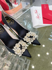 EFFLORESCENCE POINTED-TOE PUMPS IN BLACK SATIN WITH CRYSTAL BUCKLE