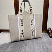 LAGRE WOODY TOTE BAG 45 IN BEIGE LINEN CANVAS BLACK WEBBING LOGO EMBROIDER WHITE CALFSKIN