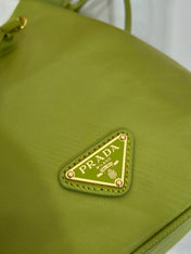 BUCKET BAG 19 IN APPLE GREEN RE-NYLON AND SAFFIANO LEATHER HANDLE