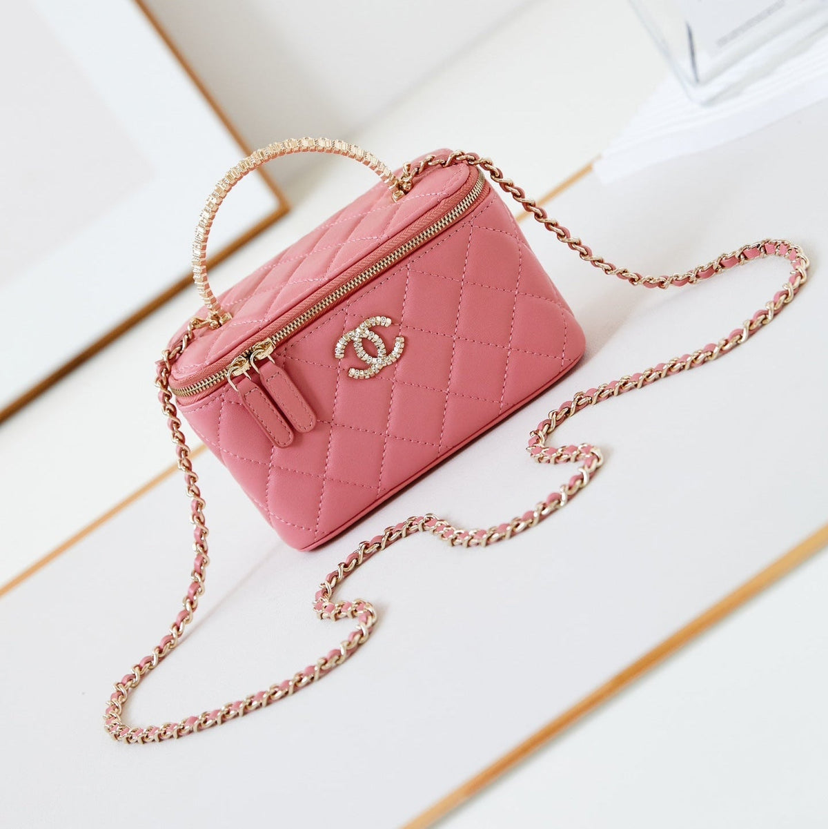 CHANEL 25S MINI VANITY BAG 16 CM IN PEACHY PINK LAMBSKIN WITH CRYSTAL-EMBELLISHED CC LOGO