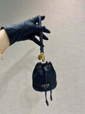 MINI BUCKET BAG 10 IN BLACK RE-NYLON AND SAFFIANO LEATHER STRAP