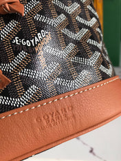 PETIT FLOT BUCKET BAG 22 IN BLACK GOYARDINE CANVAS AND TAN LAMBSKIN TRIM