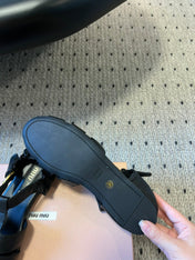 MIUMIU 26S FISHERMAN SANDALS IN BLACK RUCHES NAPPA CALFSKIN