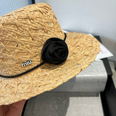 MM STRAW HAT IN BEIGE RAFFIA WITH BLACK FLOWER ACCENT