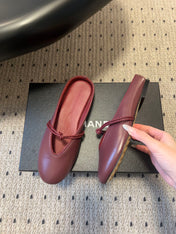 BOTTEGA VENETA 26S FLAT MULES IN DARK RED LAMBSKIN