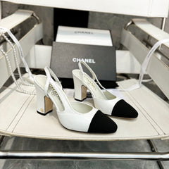 HIGH SLINGBACK IN BLACK FABRIC AND WHITE CALFSKIN