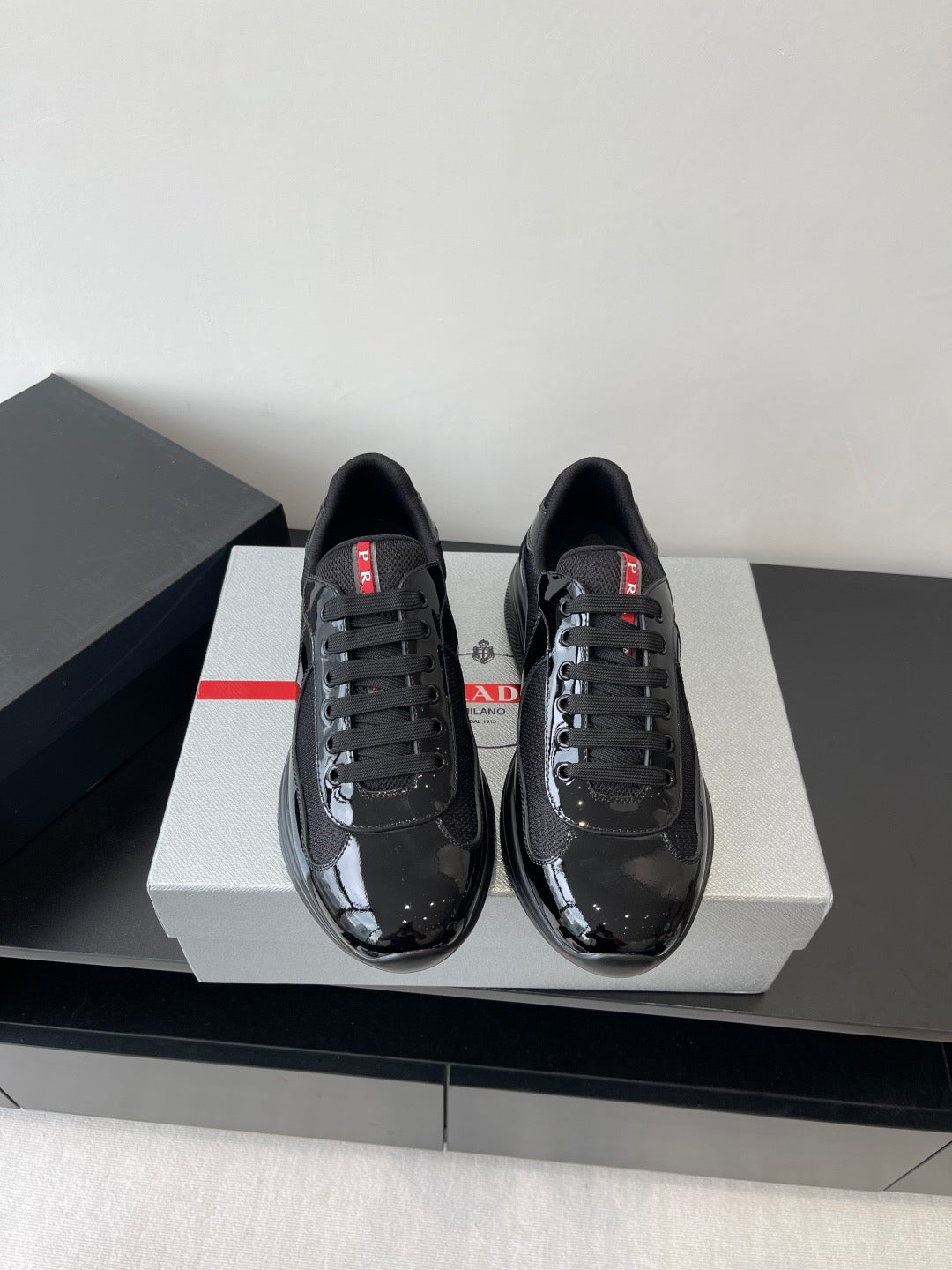 PRADA SNEAKER 25S IN BLACK MESH AND PATENT CALFSKIN