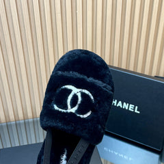CHANEL 25S THICK-SOLED FURRY SLIPPERS WITH ELASTIC STRAPS IN BLACK FUR