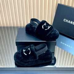 CHANEL 25S THICK-SOLED FURRY SLIPPERS WITH ELASTIC STRAPS IN BLACK FUR