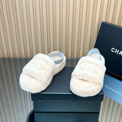 CHANEL 25S THICK-SOLED FURRY SLIPPERS WITH ELASTIC STRAPS IN BEIGE FUR