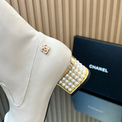 CHANEL 25S TALL BOOTS WITH PEARL DETAILS 50MM IN WHITE CALFSKIN AND BLACK SUEDE