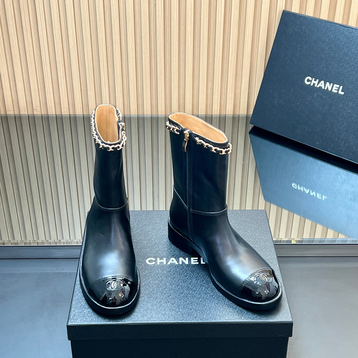 CHANEL 25S SHORT BOOTS WITH CHAIN IN BLACK CALFSKIN