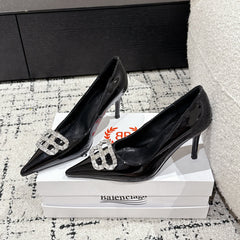 POINTED HIGH PUMPS IN BLACK PATENT CALFSKIN WITH CRYSTAL BUCKLE