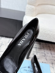 PRADA 26S POINTED-TOE HIGH HEELS 60MM IN BLACK PATENT CALFSKIN WITH LOGO