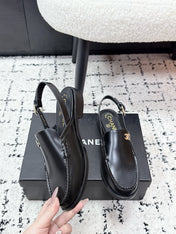 CHANEL 26S SLINGBACK LOAFERS IN BLACK PATENT CALFSKIN WITH CC LOGO