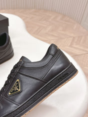 PRADA 25S DOWNTOWN SNEAKERS IN BLACK CALFSKIN