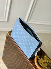 POCHETTE VOYAGE 26 IN LIGHT BLUE MONOGRAM ECLIPSE CALFSKIN