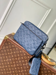 TRIO MESSENGER 25 IN BLUE MONOGRAM SHADOW CALFSKIN