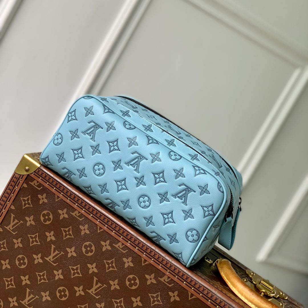 DOPP KIT 28 IN SKY BLUE MONOGRAM SHADOW CALFSKIN EMBOSSED LOGO