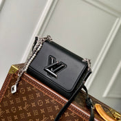TWIST SLIM 19 IN BLACK TAURILLON CALFSKIN WITH PEARL CHAIN