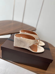 ALAIA WEDGE THONG SANDALS 25S IN LIGHT BEIGE SUEDE