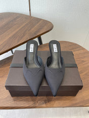 ALAIA 26S HEELED MULES 50 MM IN BLACK FABRIC