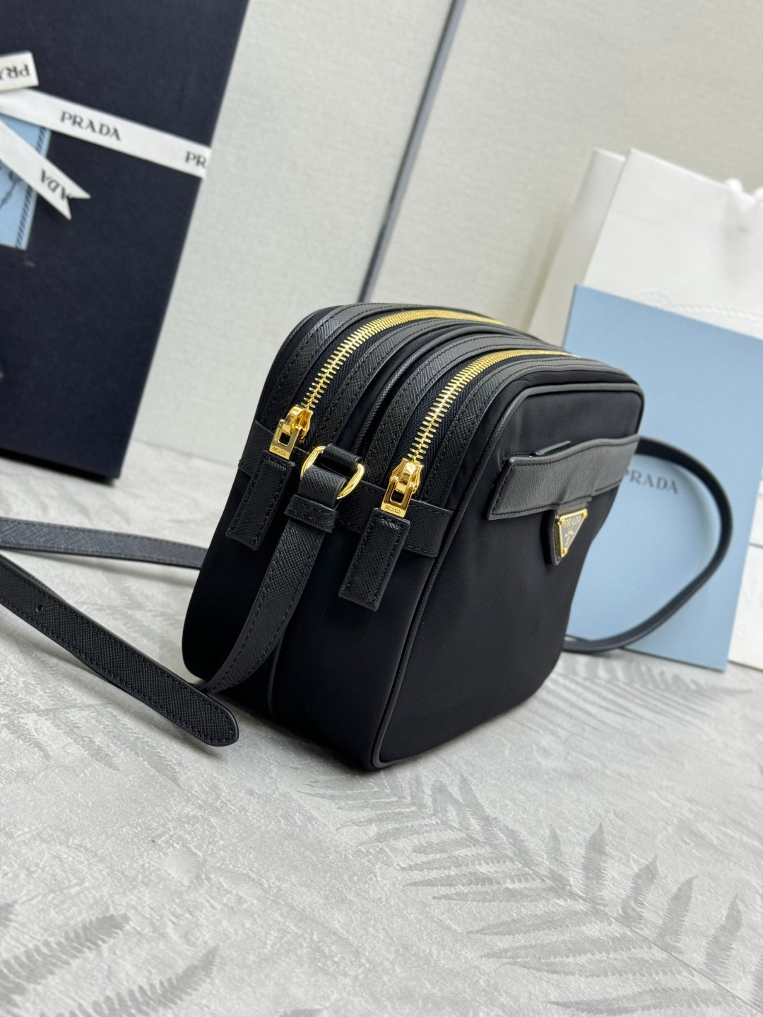 PRADA 25S RE-EDITION 1978 MINI 21 IN BLACK NYLON AND SAFFIANO CALFSKIN