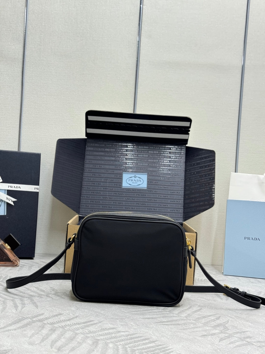 PRADA 25S RE-EDITION 1978 MINI 21 IN BLACK NYLON AND SAFFIANO CALFSKIN