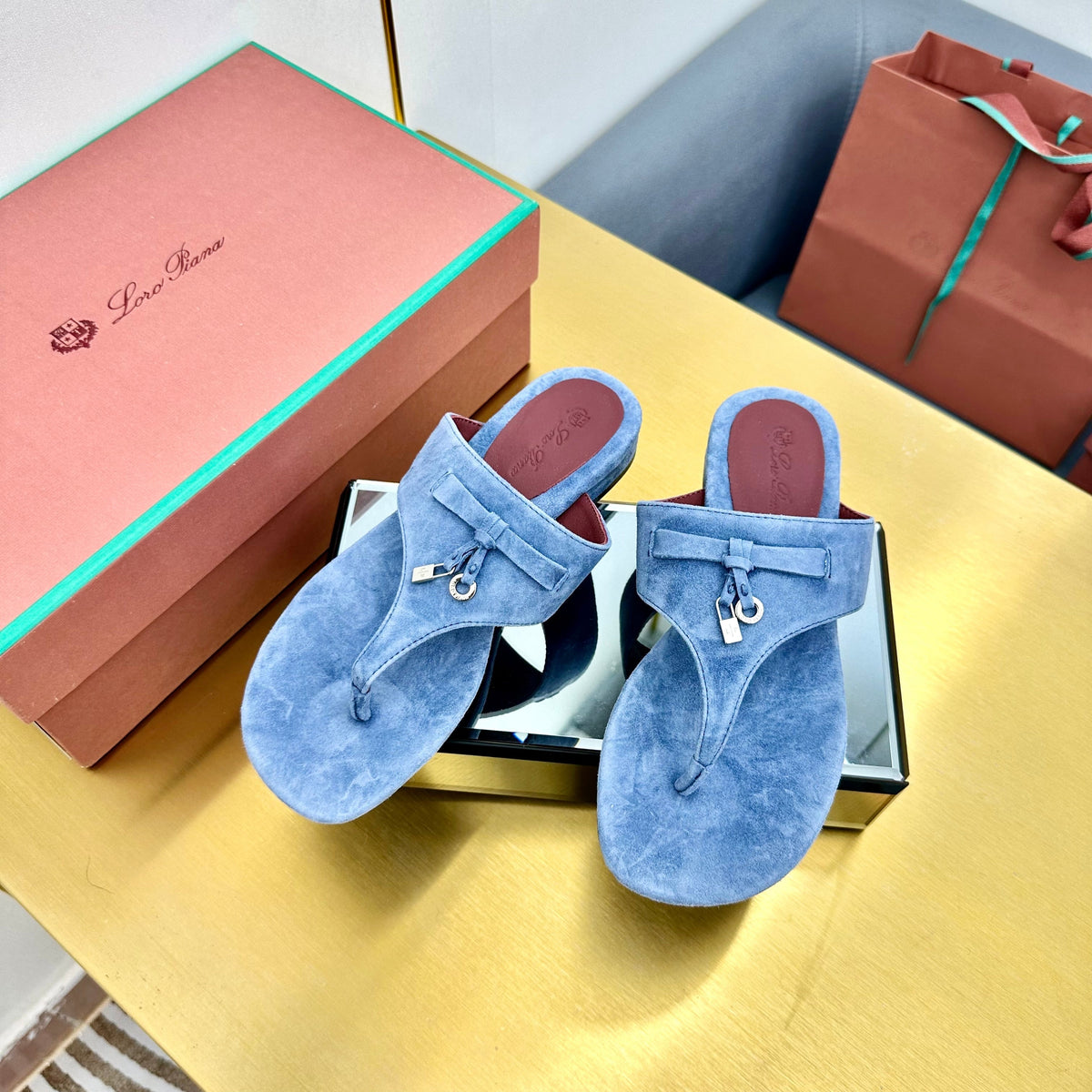 FLIP FLOPS IN BLUE SUEDE AND HARDWARE SILVER