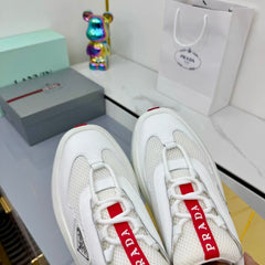 PRADA 25S CROSS LACED SNEAKERS IN WHITE CALFSKIN