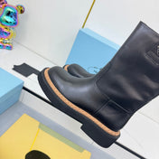 PRADA 25S HIGH MARTIN BOOTS 50MM IN BLACK CALFSKIN