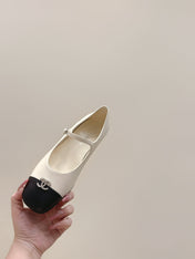 CHANEL 25S MARY JANE FLATS IN IVORY LAMBSKIN WITH BLACK CAP TOE SILVER HARDWARE