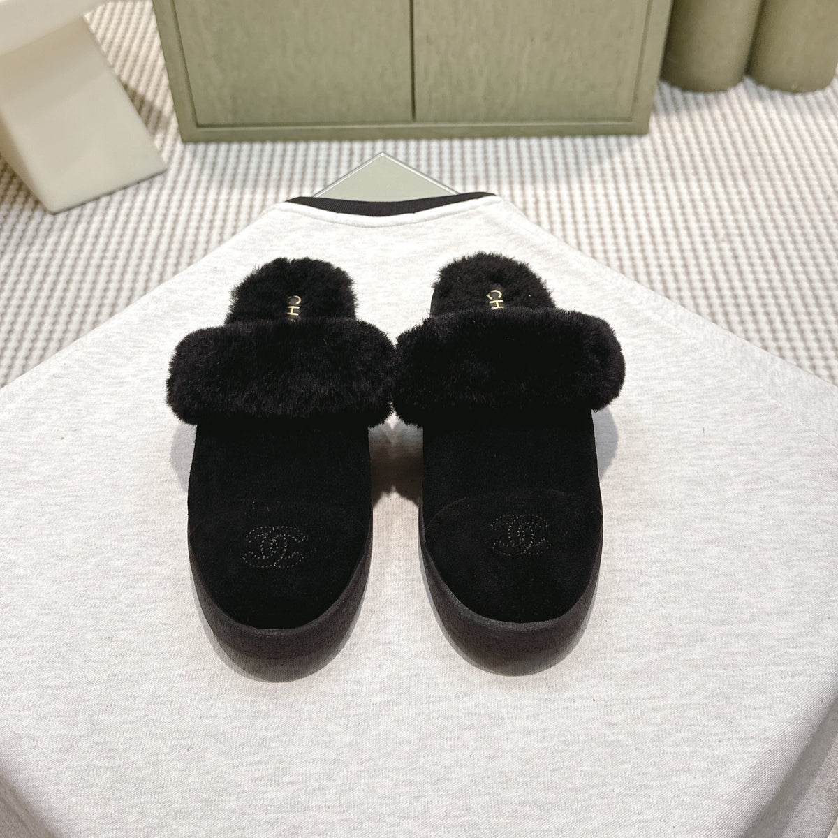CHANEL 25S FUR-LINED MULES IN BLACK SUEDE