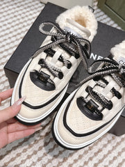 CHANEL 25S THICK-SOLE SNEAKERS IN WHITE AND BLACK CALFSKIN WITH FUR LINING