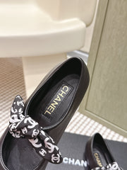 CHANEL 25S MARY JANES IN BLACK SHEARLING AND GROS GRAIN