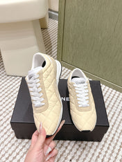 CHANEL 25S SNEAKERS IN LIGHT YELLOW CALFSKIN AND SUEDE