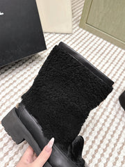 CHANEL 25S ANKLE BOOTS IN BLACK SHEARLING LAMBSKIN AND PATENT CALFSKIN