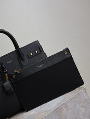 YSL 25S SAC DE JOUR GM 32 IN BLACK SUPPLE GRAINED CALFSKIN GOLD HARDWARE