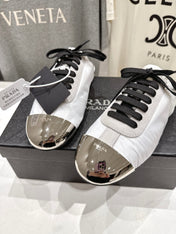 PRADA 25S MULES IN WHITE WITH METAL TOECAP