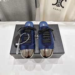 PRADA 25S MULES IN DARK BLUE WITH METAL TOECAP