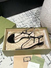 THONG SANDAL IN BLACK CALFSKIN WITH GOLD HARDWARE
