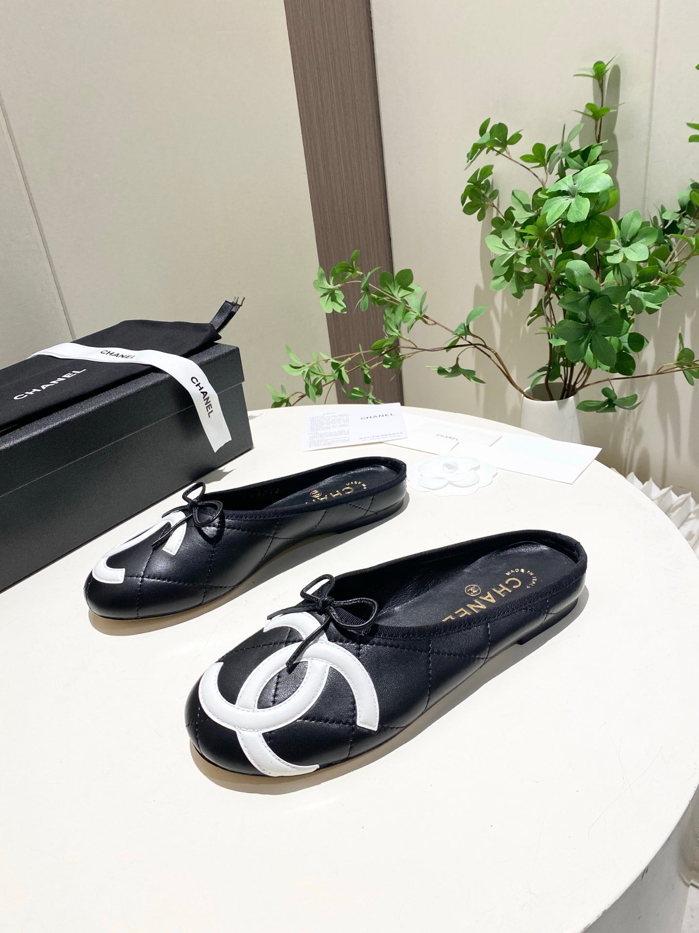 CHANEL 26S FLAT MULES IN BLACK LAMBSKIN