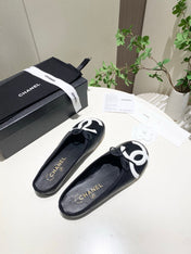 CHANEL 26S FLAT MULES IN BLACK LAMBSKIN