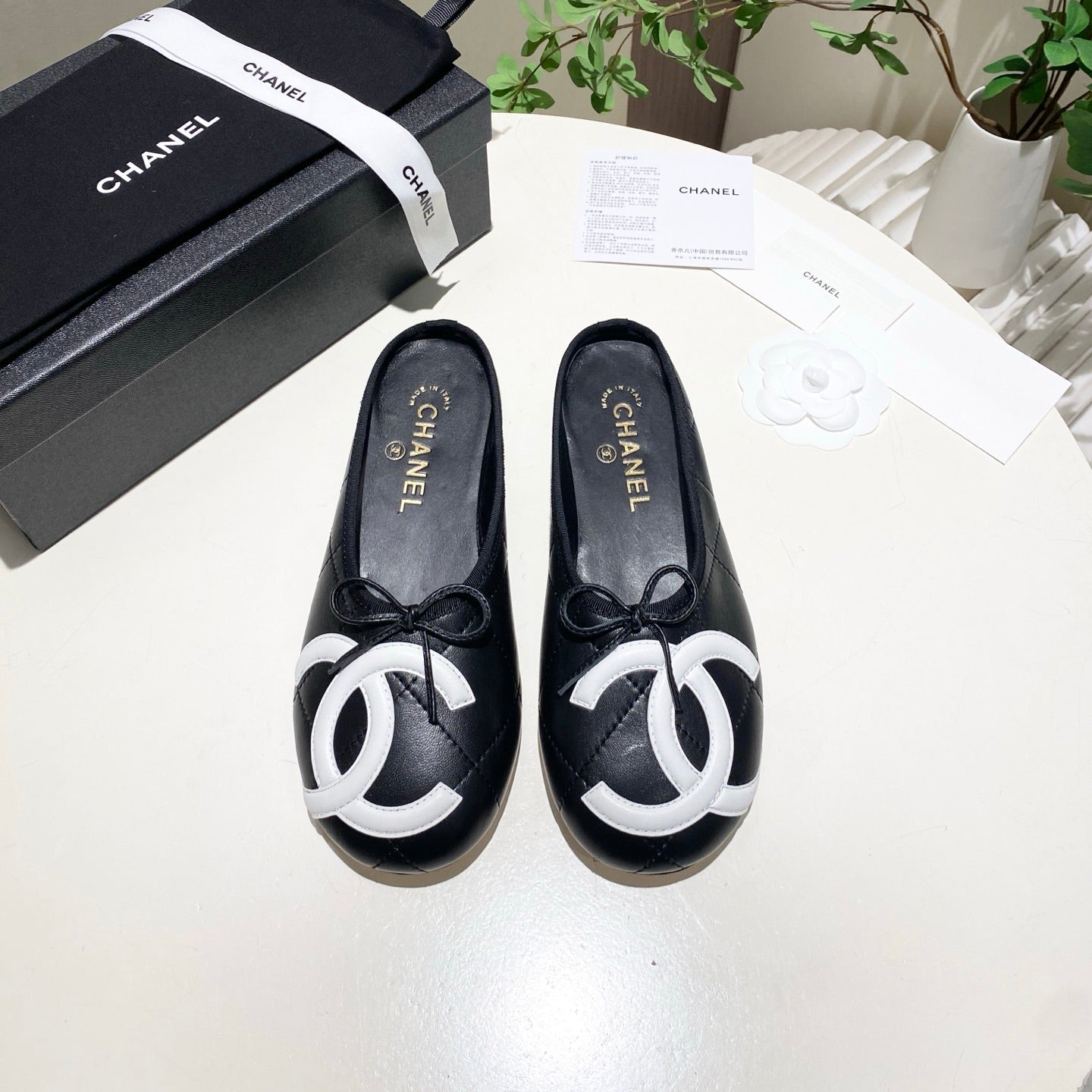 CHANEL 26S FLAT MULES IN BLACK LAMBSKIN