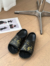 POOL GRAFFITI CROCS SLIDE SANDALS IN BLACK AND YELLOW RUBBER
